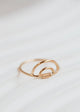 A 14k gold fill wire wrapped ring in a double rainbow shape, a statement ring for any ring stack created by Hello Adorn.