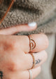 A minimalist double arch rainbow ring stacked beautifully with other 14kt Gold Fill rings.