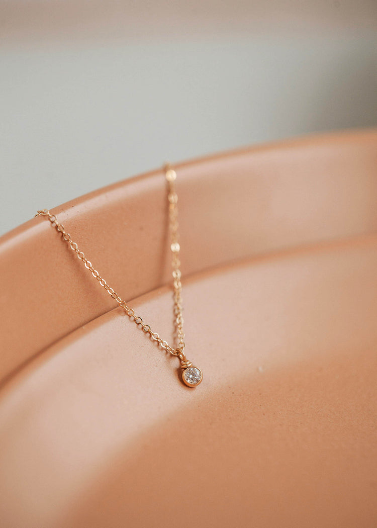 A beautiful solitaire necklace suspended from a delicate 14kt Gold Fill chain.