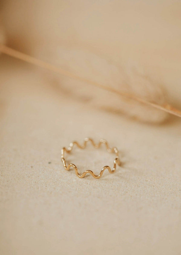 A curved ring with a zig zag ring look, handmade jewelry by Hello Adorn shown in 14k gold fill.