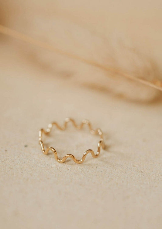 A curved ring with a zig zag ring look, handmade jewelry by Hello Adorn shown in 14k gold fill.