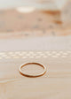 Gold Tenny-Tiny Band perfect for stacking rings By Hello Adorn.