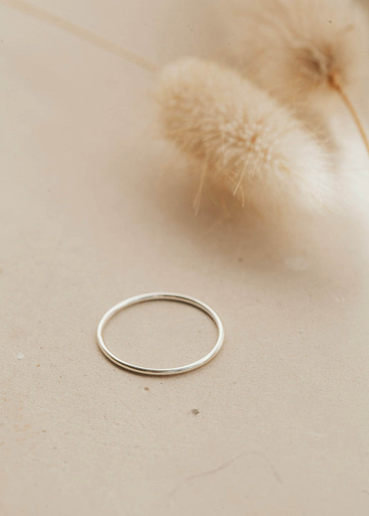 Teeny-Tiny Band by Hello Adorn as a silver stacking ring.
