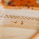 A close up look at a pair of gold ball stud earrings made for daily wear earrings shown in 14k gold fill by Hello Adorn.