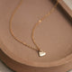 Small heart charm on a delicate 14kt Gold Fill necklace.