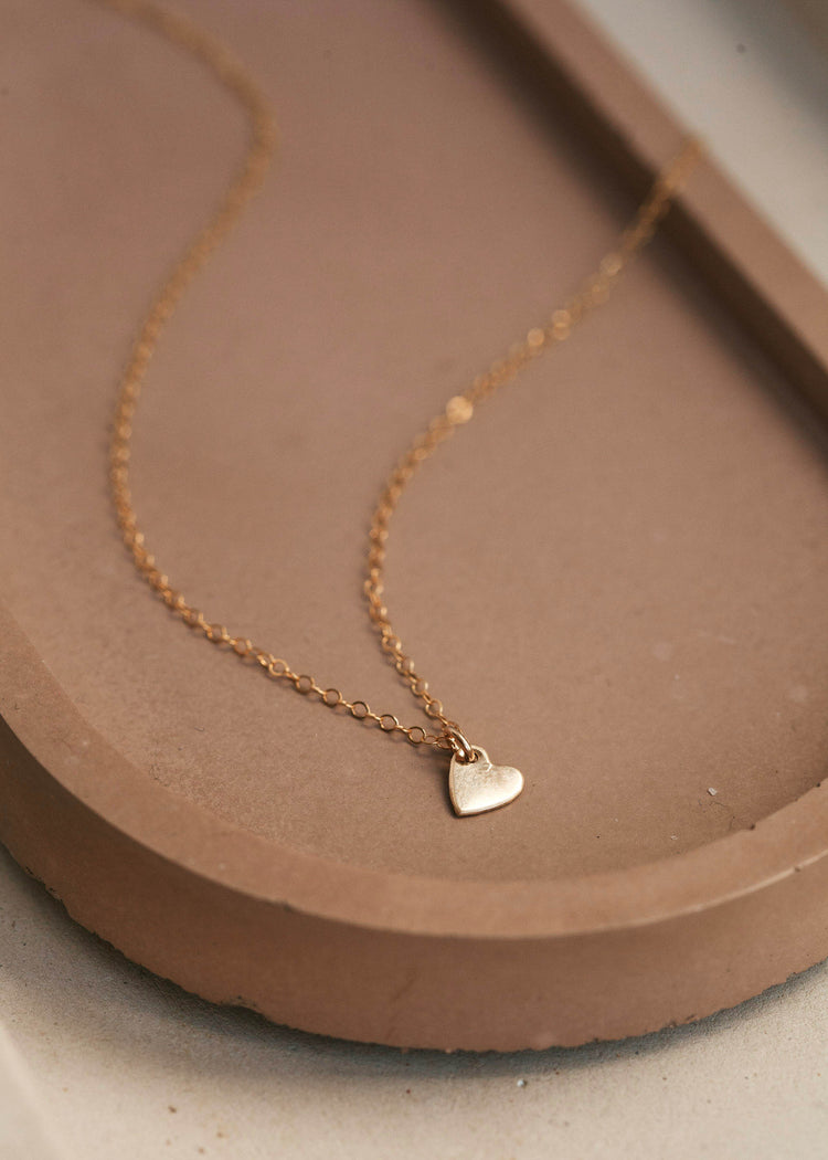 Small heart charm on a delicate 14kt Gold Fill necklace.