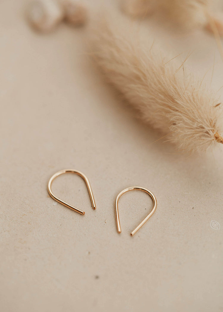 Tiny horseshoe gold threader earrings by Hello Adorn.