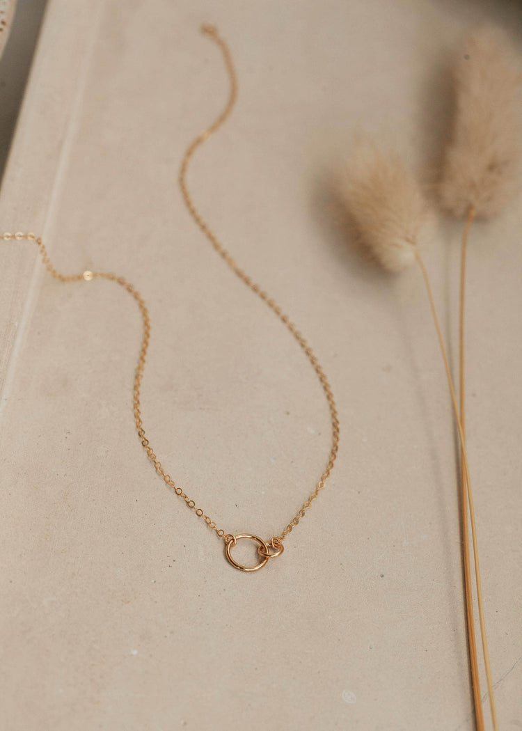 14k gold fill interlocking circle necklace by Hello Adorn laying flat.