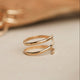 A wrap ring shown in 14k gold fill created using thicker wire to make it look like 2 rings together, handmade jewelry by Hello Adorn.