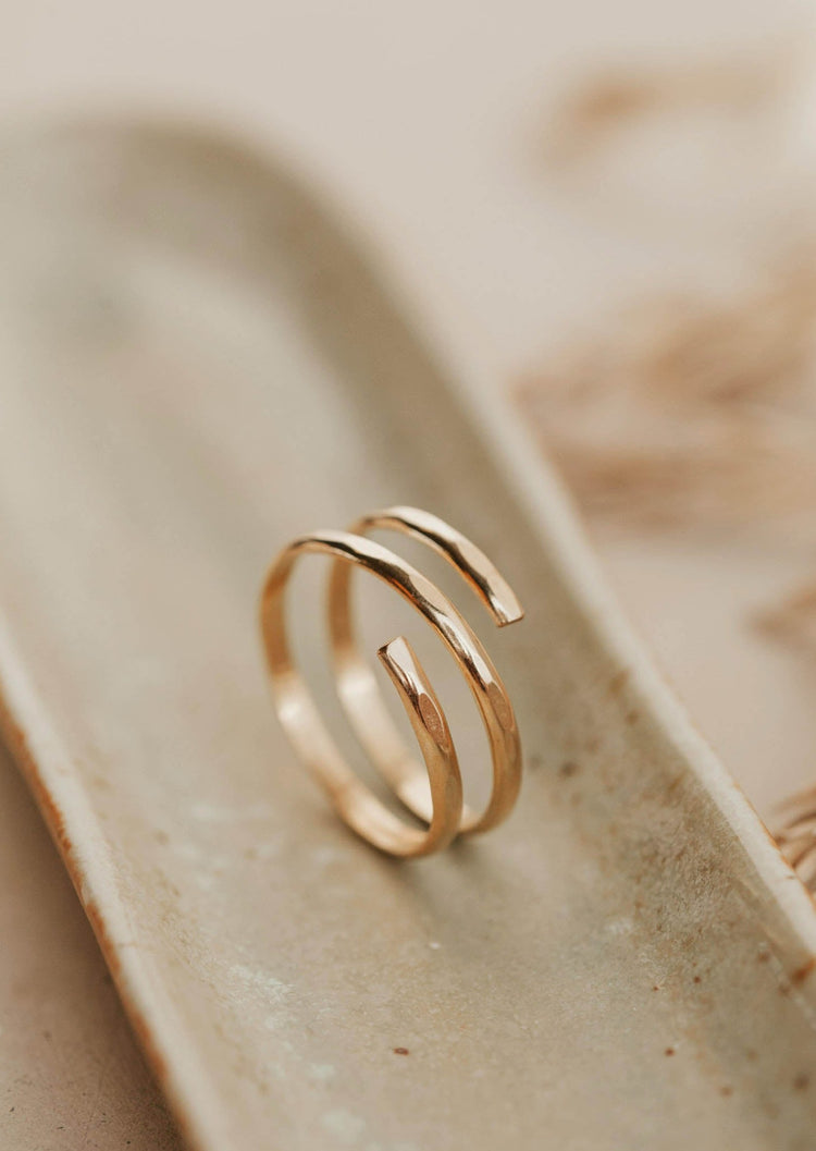 A wire wrapped ring created by Hello Adorn to make a wrap ring look like 2 rings together using thicker wire, a great statement ring to add to any ring stack.